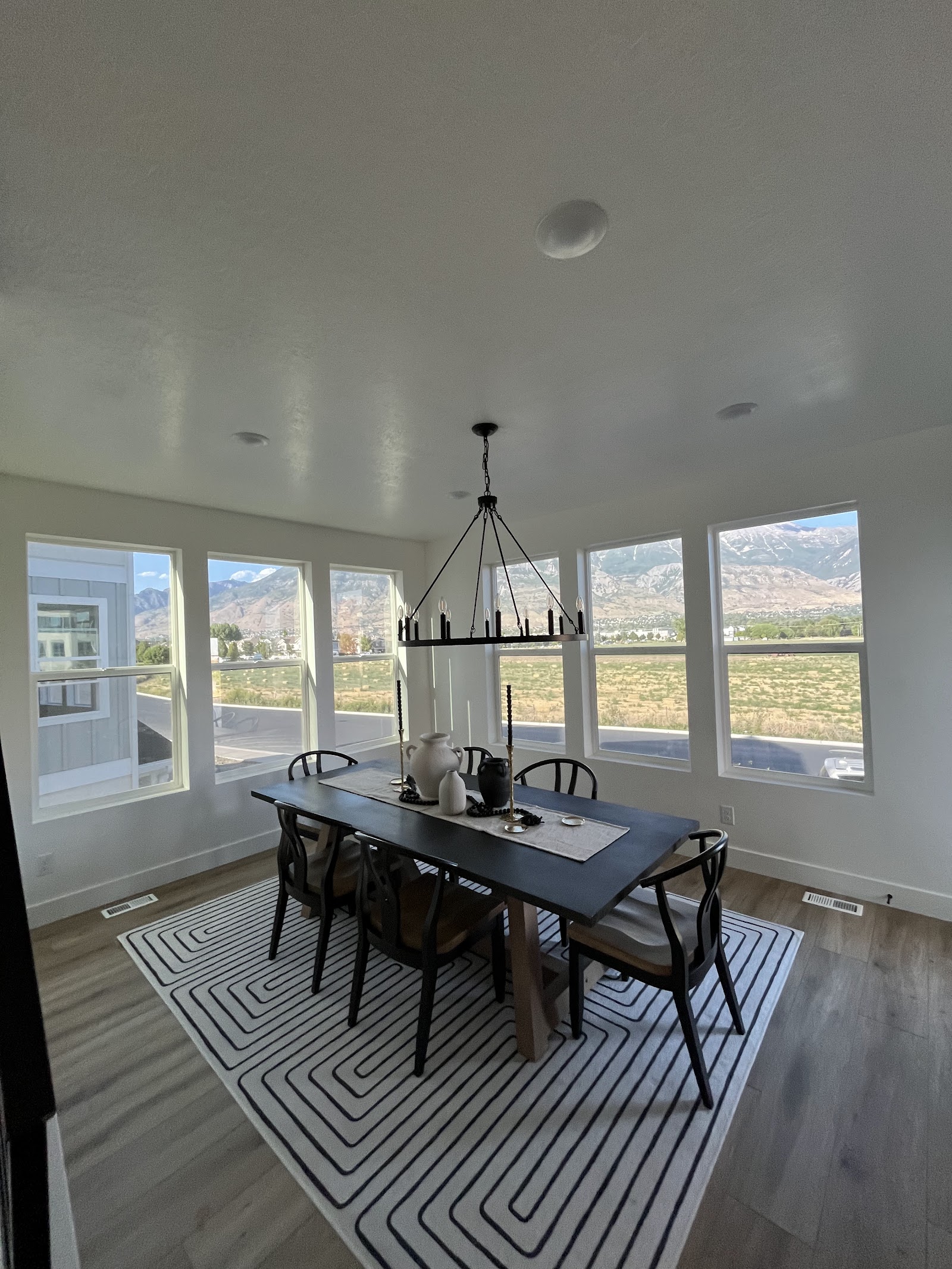 Dining room with large tinted windows overlooking a mountain view