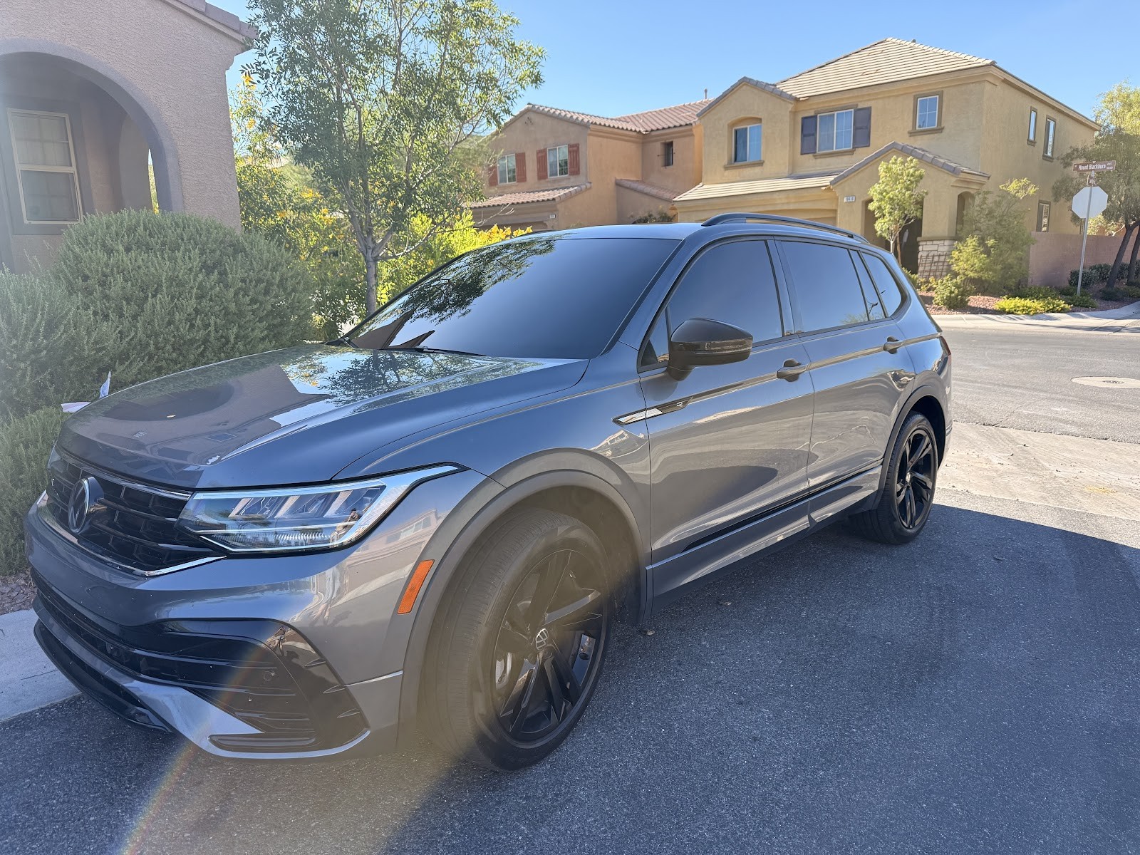 Gray Volkswagen Tiguan with freshly tinted windows parked outdoors